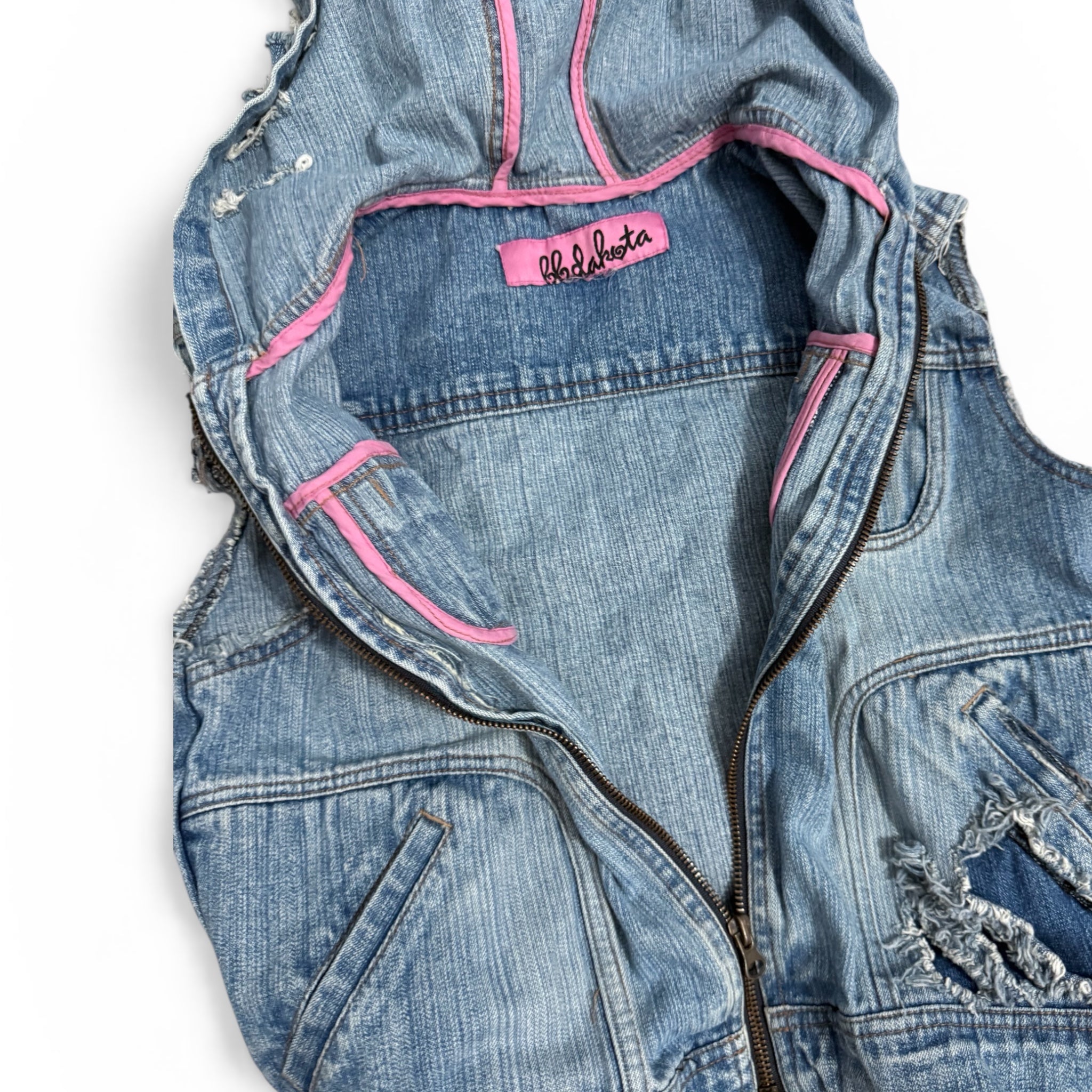 denim vest with pink accents